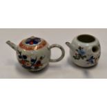 A Japanese Kakiemon bullet shaped teapot (damaged) together with a modern teapot;