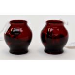 A pair of Royal Doulton Flambe Ware miniature vases, of bulbous form, marked to the base,