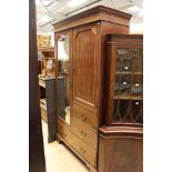 An Edwardian mahogany compactum wardrobe, comprising mirrored door, panelled door,