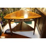 A triangular oak coffee table, 1960s, 64cm W x 46cm H and a nest of 3 teak side tables,