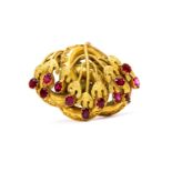 A mid Victorian pinchbeck brooch, foliate details set with purple fil backed paste,