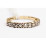 A diamond half hoop eternity ring, set eleven old cut graduated diamonds, band probably 18 ct,