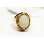 An opal and 9ct gold dress ring, oval opal approx 13mm x 10mm, rope border detail, size M1/2,