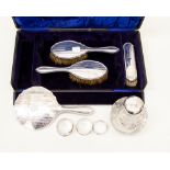 Early 20th Century four piece silver brush and mirror set, Birmingham hallmarked 1930,