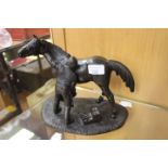 A TEM MACKIE bronzed resin cast figurative group "The Farrier" TM65