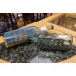 Early 20th Century ship in bottle, 21 cms long and a later ship in bottle,