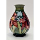 A Moorcroft Baluster vase, orchid and Spring flowers patterned, green and blue merging,