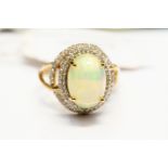 An opal dress ring, oval opal approx 9mm x 13mm,
