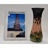 A Moorcroft tube lined "Cluny" vase, by Sally Tuffin plus a Moorcroft pottery reference book,