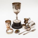 A collection of silver including small trophy, cutlery,