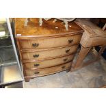 A George V walnut bow fronted chest of drawers,