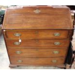 A George III mahogany bureau, the fall front enclosing a fitted interior,