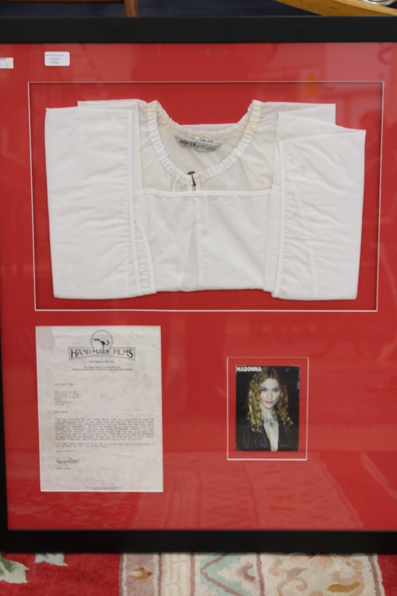 Madonna full length "make up" cape w/original lipstick, framed and mounted with authentication.