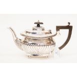A silver teapot hallmarked in Birmingham 1919,