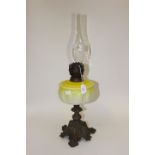 19th Century lamp with cast iron base and yellow glass decoration A/F