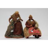 Two folk art dolls,