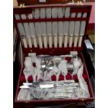 A cased canteen of Old English pattern stainless steel flatware together with monogram stainless