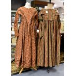 A 1820-25 paisley patterned cotton late Regency dress in a khaki coloured paisley print with a
