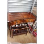 A Georgian style mahogany concave side table, fitted with two drawers,