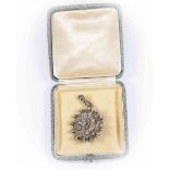 A Victorian diamond set pendant brooch, tiered circular design set with rose cut diamonds,