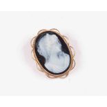 A black and white oval cameo,