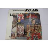 A collection of music memorabilia relating to LIVE AID, including Live Aid programme, calendar,