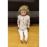 A lady doll, painted face as found, glass eyes, fingers and feet intact, kid style body,