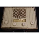 A Marconiphone late 1950's mains or battery radio - faux snakeskin veneer