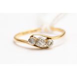 An Edwardian three stone diamond set ring, 18ct gold, size P1/2,