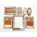 Five silver mounted picture frames and two silver mounted hair brushes