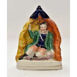 A 19th Century Staffordshire chimney figure of a man in tent