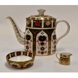Royal Crown Derby 1128 Imari pattern teapot together with a miniature cream jug and small sugar