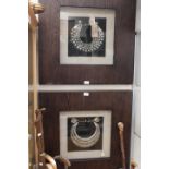 Two framed decorative white metal collars,