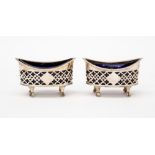 A pair of oval silver salts, with blue glass liners, Chester 1908,