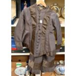 A taffeta mushroom coloured Victorian two piece (1880's); the long line jacket has covered buttons,