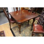 An Edwardian mahogany dining table raised on cabriole legs with pad feet.
