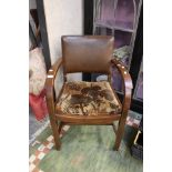 A 1940's oak open armchair.