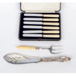 A set of six plate butter/side knives in case together with a fish slice engraved with fish on