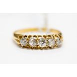 A diamond five stone set boat head ring, graduated diamonds claw set, size L,