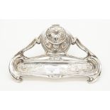 An electro plated silver art nouveau style inkwell, with floral design, circa 1900.