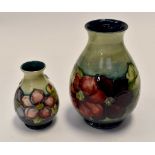 Late 20th Century Moorcroft vase - approx 21 cms - plus a smaller vase 13 cms high approx (2)