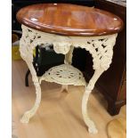 A white painted cast iron pub table