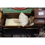 A dolls rocking cradle, rocking chair and pram,