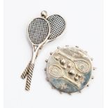 Tennis Interest, two silver tennis racket brooches, one as two crossed with ball,