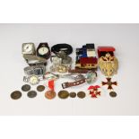 A collection of assorted modern pocket watches and coins