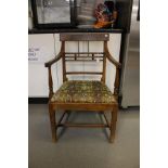 A George III joined elm open armchair, circa 1800, drop in seat,