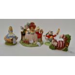Disneys Alice in Wonderland figurine collection x 4 by Royal Doulton entitled "Showcase collection"