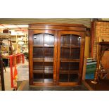 An early 20th Century bureau bookcase, the upper section with two glazed doors,