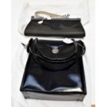 A Karl Lagerfeld black leather handbag with white metal mounts (handle A/F) along with dust bag,