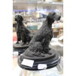 Two bronzed red setters of marble stands